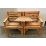 A pair of pine garden chairs with central joining table (Saleroom location: MW MA3)