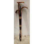 Four walking sticks and a shoe horn (Saleroom location: H02)