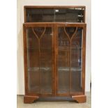 Mahogany china cabinet with two sliding glass doors to upper section and two glass doors to lower,