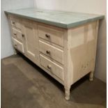 White painted pine kitchen unit with a light green eggshell formica top over six drawers with