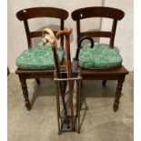 Two dark mahogany stained dining chairs with turned legs,