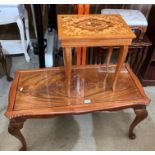 A walnut coffee table on cabriole legs with glass inset top,