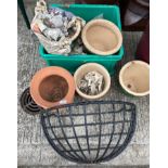 A black coated metal hay rack and six small planters (7) (saleroom location: outside)