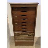 An early 20th century oak filing cabinet with tambour front shutter, 57cm x 44.