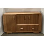 Mid-century oak finish G-Plan Bradon cocktail cabinet with three doors and a single drawer,