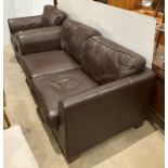 Brown leather two seater sofa and matching armchair (Saleroom location: Kit)