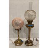 Two assorted brass converted oil/paraffin lamps,