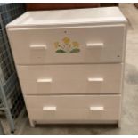 A white painted pine three drawer chest of drawers,