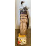 A Penfold tan/brown golf bag complete with twelve assorted golf clubs by Regency, Slazenger,