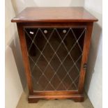 Mahogany finish music cabinet with lift top and single leaded glazed door,