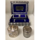 A silver coloured jewellery box (internal mirror cracked),
