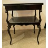 Ebonised mahogany spin and fold top card table with undershelf,