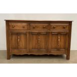 Ercol Lavenham dresser base, model 962D, with three drawers and three doors, in elm Golden Dawn,