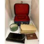 A Debroyal lady's blue vanity case containing two handbags,