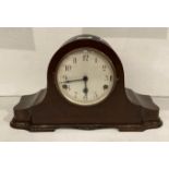 Mahogany mantel clock with round face and five hammer chime, with pendulum,