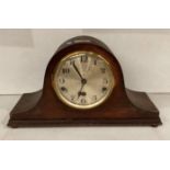 Mahogany finish mantel clock with circular face by D.R.G.M.