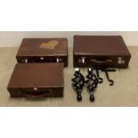 Three brown fibre small suitcases and a pair of black metal curtain pole ends (5) (Saleroom