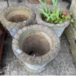 Three concrete ribbed-top planters,