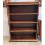 An oak five shelf open front bookcase,