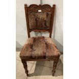 Oak carved chair with turned legs and cushioned back and seat (Saleroom location: Kit)