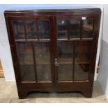 Dark stained mahogany china cabinet with two glazed doors,