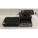 An Imperial 58 manual typewriter and a black metal deed box,