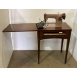 A Singer 201K electric foot operated sewing machine in a mahogany cabinet with single pull down
