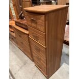 An Alstons Cabinets Ltd Canterbury range wood finish four drawer chest of drawers,