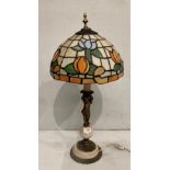 Marble and brass table lamp with cherub figure to stem and Tiffany style shade,