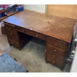 Vintage oak twin pedestal desk with central long drawer and four drawers and slide to either side,