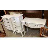 Three pieces of white bedroom furniture comprising five drawer (two short,