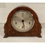 Walnut finish mantel clock with circular face by Enfield Royal, no pendulum, five hammer chime,
