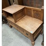 An oak hall seat and telephone table with carved design to front, 90cm x 68cm high by J.R.