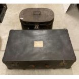 Black fibre trunk and a large metal oval hat box (2) (Saleroom location: H06 Floor)