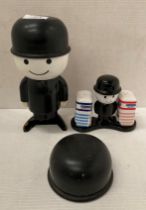 Ceramic Homepride salt and pepper pots on stand and a Homepride plastic figure (damaged) (saleroom