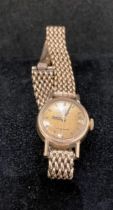 9ct gold "Omega" "Ladymatic" ladies' wrist watch with a 9ct gold chain strap, 1960s.