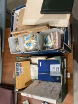 Contents to two boxes - a large quantity of loose GB and World stamps,