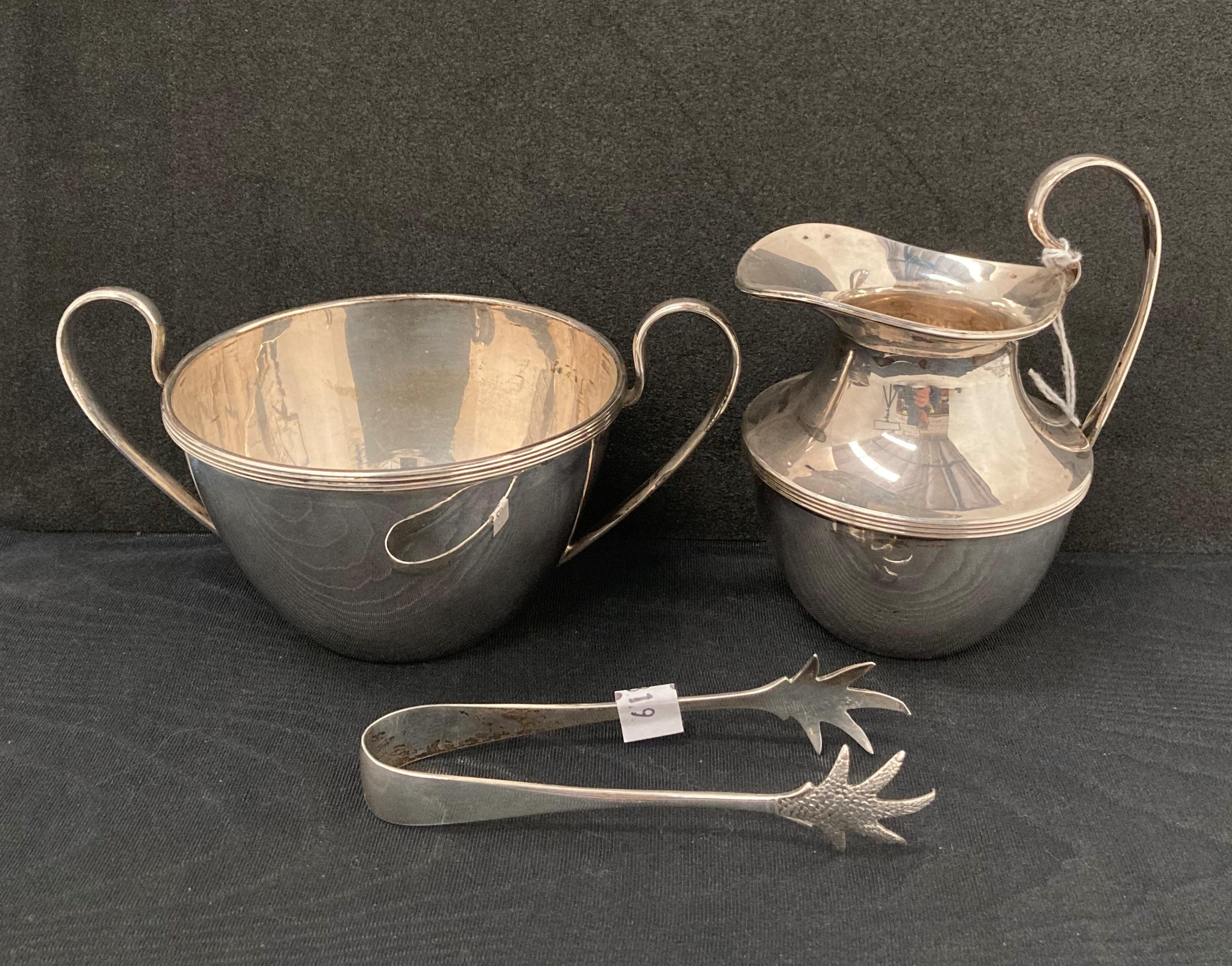 Silver [hallmarked] double handled cup with a matching cream/milk jug by AW & JH, Sheffield 1926,