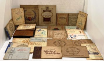 Twenty-five full and part cigarette card albums including railway engines, boxers,