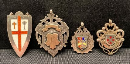 Four assorted silver [hallmarked] award medals, Birmingham 1906, 1907, 1911.