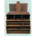 Pair of solid oak bookends with coat of arms "Per Ad Ardua Alta" and on the other "Men's Agitate