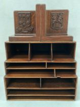 Pair of solid oak bookends with coat of arms "Per Ad Ardua Alta" and on the other "Men's Agitate
