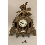 Imperial brass mantel clock with white painted face and brass horse man to top,