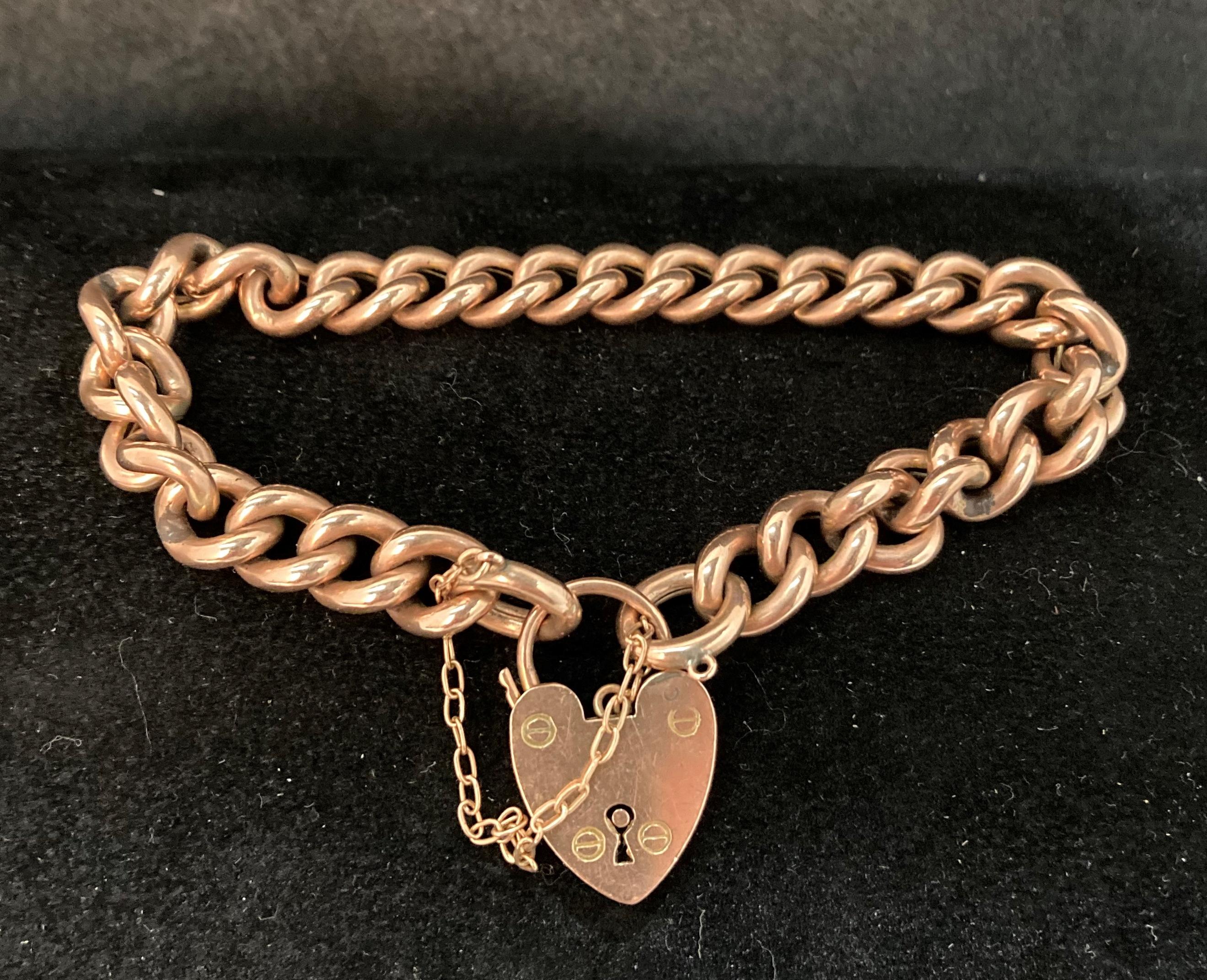 9ct gold hollow-link bracelet with heart-shaped padlock clasp. Weight - 17.