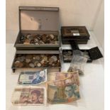 Contents to two cash tins - a large quantity of coins (one penny, one shilling, half crown,