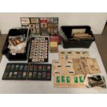 Contents to two boxes - assorted postcards, cigarette cards including airplanes, military, flags,