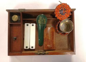 Contents to boxes - a broken writing box containing travel-sized items including,