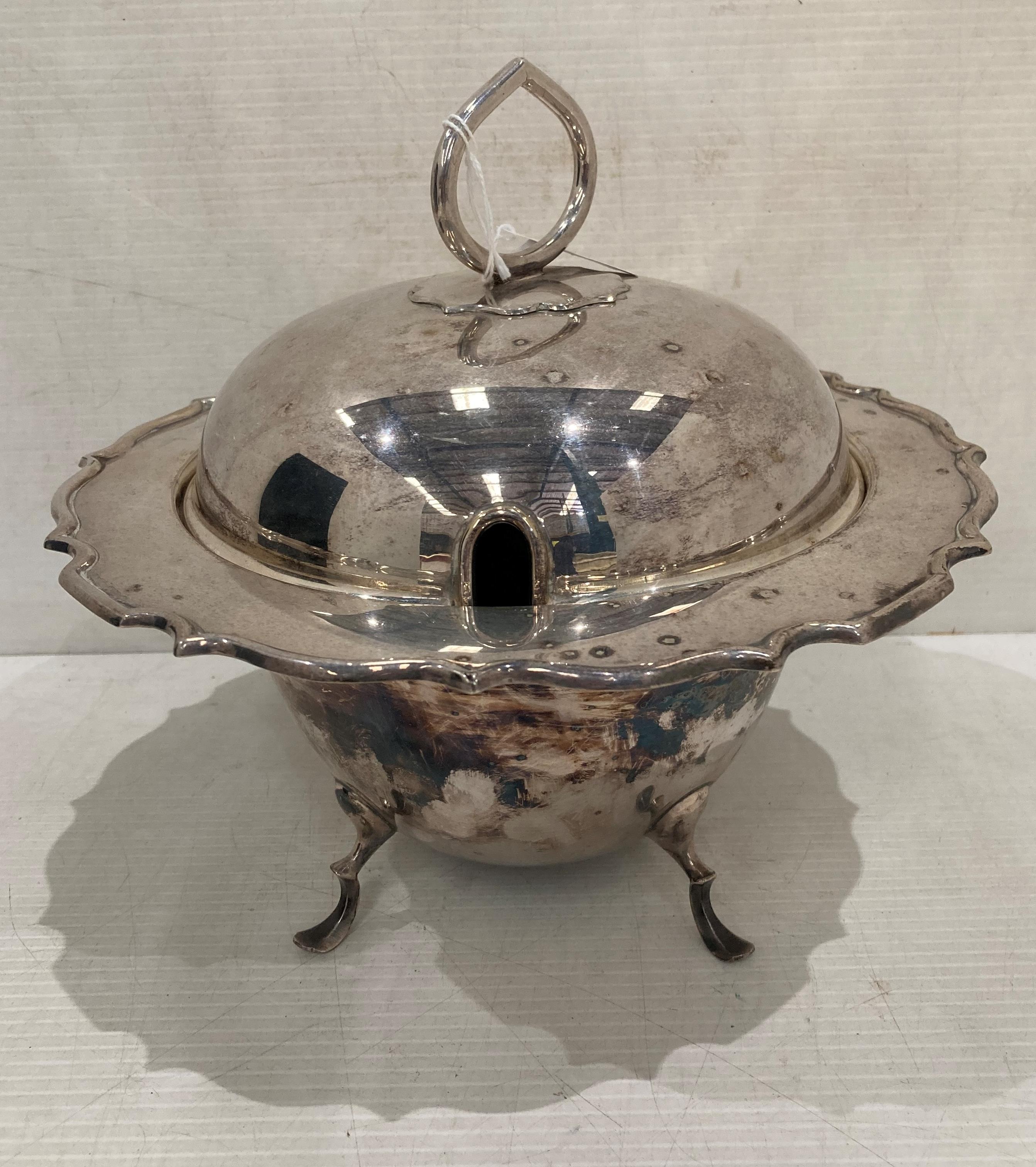 Silver soup serving dish on four feet with handled lid (no markings visible) (saleroom location: