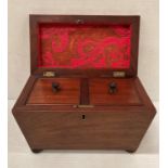 Mahogany sarcophagus tea caddy with twin compartments, both with lids, on bun feet,