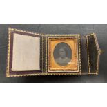 A leather bound fold out Antique Glass Ambrotype photograph in an ornate ormulu frame (dates back